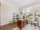 Bright home office with a large wooden desk and ample natural light at 121 Hanks Bluff Dr, Mooresville, NC 28117
