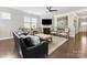 Inviting living room with fireplace, large windows, and comfortable seating at 121 Hanks Bluff Dr, Mooresville, NC 28117