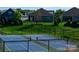 View of community tennis courts with well-maintained landscaping and adjacent homes at 121 Hanks Bluff Dr, Mooresville, NC 28117