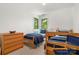 Spacious bedroom with wood frame bunk beds, dresser, and natural light at 121 Rhinehill Dr, Mooresville, NC 28117