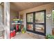 Home's inviting covered front entrance with double doors and fun decor at 121 Rhinehill Dr, Mooresville, NC 28117