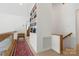Hallway with wooden floors, bookshelves, and view to another room at 121 Rhinehill Dr, Mooresville, NC 28117