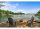 Beautiful lakeside view featuring patio seating area with lake access with space for entertaining at 121 Rhinehill Dr, Mooresville, NC 28117