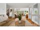 Open-concept living room with a cozy seating area with access to other living spaces at 121 Rhinehill Dr, Mooresville, NC 28117