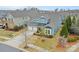 Two-story home with blue siding, a three-car garage, and a manicured front yard at 12619 Old Westbury Dr, Cornelius, NC 28031