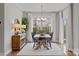 Inviting dining room with a wooden table, chandelier, and natural lighting at 12619 Old Westbury Dr, Cornelius, NC 28031