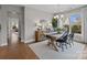 Beautiful dining room with hardwood floors and view of neighborhood at 12619 Old Westbury Dr, Cornelius, NC 28031