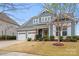 Charming two-story home with a two-car garage, landscaped yard, and inviting curb appeal at 12619 Old Westbury Dr, Cornelius, NC 28031