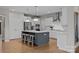 Modern kitchen featuring stainless steel appliances and gray island with seating at 12619 Old Westbury Dr, Cornelius, NC 28031