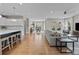 Open concept living space with hardwood floors, modern decor, and ample natural light throughout at 12619 Old Westbury Dr, Cornelius, NC 28031