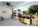 Outdoor back porch with a ceiling fan and view of the backyard pool and play set at 1300 Aragon Beach Rd, Rock Hill, SC 29732