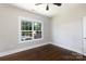 Bedroom with hardwood floors and a window overlooking the pool at 1300 Aragon Beach Rd, Rock Hill, SC 29732