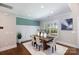 Dining room boasts modern lighting, wainscoting, and a bright window view at 1300 Aragon Beach Rd, Rock Hill, SC 29732