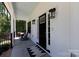 Charming front porch with classic rocking chairs and stylish lighting fixtures. A welcoming entrance! at 1300 Aragon Beach Rd, Rock Hill, SC 29732