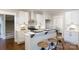 Bright kitchen with white cabinetry, stainless steel appliances, and breakfast bar with seating at 1300 Aragon Beach Rd, Rock Hill, SC 29732
