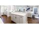 Open-concept kitchen flows into a living area with white cabinets and a spacious island at 1300 Aragon Beach Rd, Rock Hill, SC 29732
