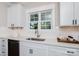 Bright kitchen showcasing white cabinets and a modern faucet with a window offering natural light at 1300 Aragon Beach Rd, Rock Hill, SC 29732