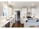 Well-lit kitchen featuring white cabinets, quartz countertops, and stainless steel appliances and fixtures at 1300 Aragon Beach Rd, Rock Hill, SC 29732