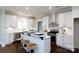 Stylish kitchen features white cabinets, stainless steel appliances, and a convenient breakfast bar at 1300 Aragon Beach Rd, Rock Hill, SC 29732