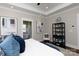 Comfortable main bedroom showcasing an ensuite bathroom and a decorative bookshelf at 1300 Aragon Beach Rd, Rock Hill, SC 29732