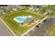 This aerial view shows the community pool, playground, clubhouse, and ample parking in a desirable neighborhood at 136 Asmodean Ln, Troutman, NC 28166