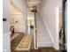Bright entryway with wood floors and view into the home at 136 Asmodean Ln, Troutman, NC 28166