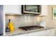 Close-up of granite counter-top and gas range in a kitchen at 136 Asmodean Ln, Troutman, NC 28166