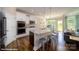 Kitchen island with sink and stainless steel appliances at 136 Asmodean Ln, Troutman, NC 28166