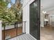 Balcony view with sleek railings and a view into the home's dining area and kitchen at 1413 Kenilworth Ave, Charlotte, NC 28203