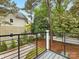 This outdoor balcony overlooks the backyard and features a sleek black railing at 1413 Kenilworth Ave, Charlotte, NC 28203