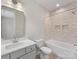 Bathroom featuring single vanity, quartz countertops, shower over tub with modern fixtures at 1413 Kenilworth Ave, Charlotte, NC 28203