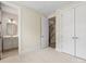 Bedroom featuring carpet, baseboard trim, recessed lights, double closet, and bathroom access at 1413 Kenilworth Ave, Charlotte, NC 28203