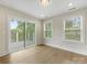 Bonus room with hardwood floors, natural light and large glass sliding door leading to deck at 1413 Kenilworth Ave, Charlotte, NC 28203