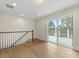 Bonus room with hardwood floors, neutral walls, natural light and access to an outdoor deck space at 1413 Kenilworth Ave, Charlotte, NC 28203