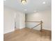 Bonus room offering hardwood floors, neutral wall colors, natural light and access to bathroom at 1413 Kenilworth Ave, Charlotte, NC 28203