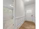 Bright foyer with hardwood floors and white trim, creating a welcoming entrance to the home's interior at 1413 Kenilworth Ave, Charlotte, NC 28203