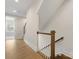 Bright hallway features hardwood floors, a staircase and leads to a room filled with natural light at 1413 Kenilworth Ave, Charlotte, NC 28203