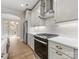 Stylish kitchen with white cabinets, subway tile backsplash, stainless steel range, and modern hardware at 1413 Kenilworth Ave, Charlotte, NC 28203