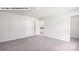 Bedroom featuring neutral carpet, and doorways leading to the bathroom and closet at 134 Asmodean Ln, Troutman, NC 28166