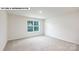 Bright bedroom featuring neutral carpet, bright walls, and a window with natural light at 134 Asmodean Ln, Troutman, NC 28166