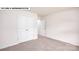 Bedroom featuring neutral carpet, white walls, and a double door closet at 134 Asmodean Ln, Troutman, NC 28166