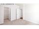 Bedroom with two doorways and neutral carpet at 134 Asmodean Ln, Troutman, NC 28166