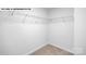 Walk-in closet featuring wire shelving and neutral walls and carpet at 134 Asmodean Ln, Troutman, NC 28166