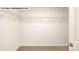 Walk-in closet featuring wire shelving, neutral walls and carpet, and bright natural light at 134 Asmodean Ln, Troutman, NC 28166