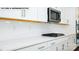Modern kitchen with white cabinets, stainless steel appliances, and subway tile backsplash at 134 Asmodean Ln, Troutman, NC 28166