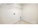 Laundry room with a tile floor, hookups, and a small pet door at 134 Asmodean Ln, Troutman, NC 28166