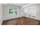 Bright living room with decorative molding, chair rail, and large window; French doors add a touch of elegance at 134 Asmodean Ln, Troutman, NC 28166