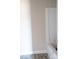 Bright bathroom features white trim and gray wood-look flooring at 1432 Blackbird Dr, Clover, SC 29710