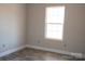 Well-lit bedroom with new flooring, a bright window, and neutral paint, creating a serene and comfortable atmosphere at 1432 Blackbird Dr, Clover, SC 29710