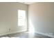 Bright bedroom featuring a window with natural light and neutral-toned walls at 1432 Blackbird Dr, Clover, SC 29710